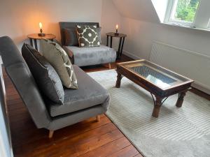 a living room with a couch and a coffee table at Floyter House North Yorkshire Moors National Park in Danby