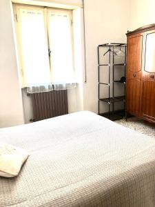 Postel nebo postele na pokoji v ubytování HOME TONINO