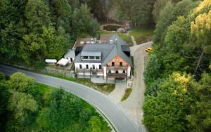 an aerial view of a house with a road at Apartmány NONE in Branná