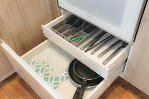 a drawer in a kitchen with utensils in it at Apartamentos Las Ciencias B in Valencia