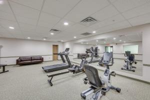 a gym with several exercise bikes in a room at Centrally Located Harrisburg Studio Near Downtown! in Harrisburg