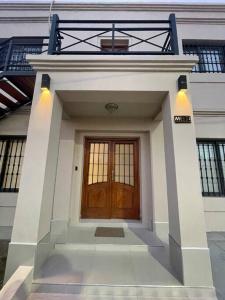 a small house with a wooden door on top of it at Departamento a estrenar en los caminos del vino in Maipú