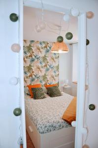 Postel nebo postele na pokoji v ubytování Dormir à Brioude - appartement 'esprit nature'