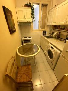 a kitchen with a sink and a washing machine at Cute 2bdrm in Salonica Center in Thessaloniki