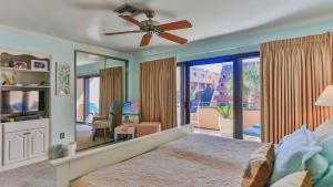 a bedroom with a bed and a large mirror at Aegean 215 - Beautiful Beachfront Condo Lots of on site Activities in Destin