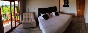 Postel nebo postele na pokoji v ubytování Hotel Gran Boutique Sabana