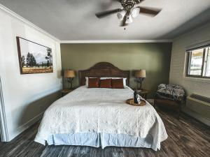 a bedroom with a bed and a ceiling fan at Woody Mountain Bed & Breakfast in Flagstaff