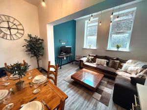 a living room with a couch and a table at The Beaumonts in Darlington