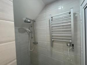 a bathroom with a shower with a shower head at Studio La Vista Sokobanja in Soko Banja