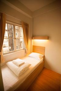 Voodi või voodid majutusasutuse Micro Hostel toas
