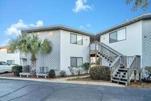 a house with a staircase in front of it at Crystal Village II 6B - Close to the Beach 2BD 2BA in Destin