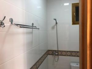 a bathroom with a shower and a toilet at Tasvir in Bukhara