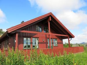 a red house with a red roof at Holiday Home Brandsbu - SOW097 by Interhome in Åseral