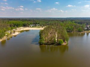 an island in the middle of a lake at Holiday Home Kemp Stříbrný rybník-10 by Interhome in Hradec Králové