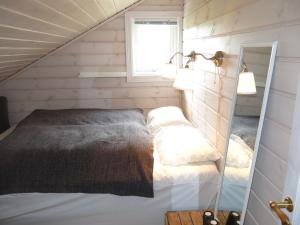 a small room with a bed in the corner at Holiday Home Fjellheimen - SOW138 by Interhome in Åseral
