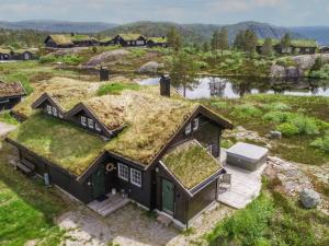an overhead view of a house with a grass roof at Holiday Home Fjellheimen - SOW138 by Interhome in Åseral