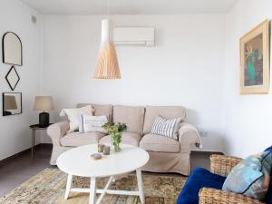 a living room with a couch and a table at Apartment Limoneros by Interhome in Nerja