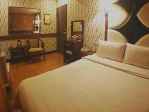 Letto o letti in una camera di Fu Chia Hotel