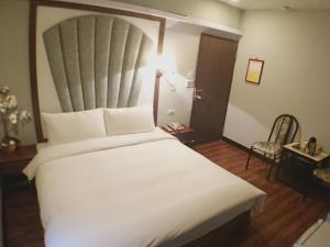 Letto o letti in una camera di Fu Chia Hotel