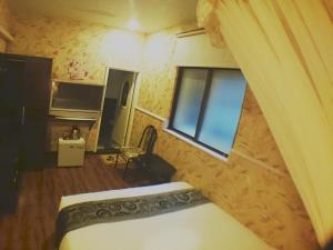 Letto o letti in una camera di Fu Chia Hotel