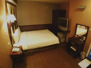 Letto o letti in una camera di Fu Chia Hotel