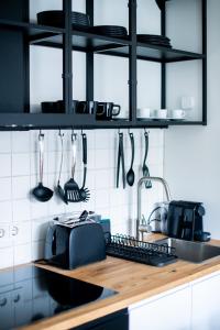 a kitchen with a counter with a toaster and a toaster at Flattering - Berlin in Berlin