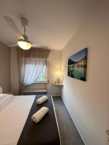 a bedroom with a bed with two pillows on it at Luxury Sea House in Trapani