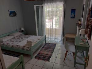 A bed or beds in a room at Marilena House Plataria