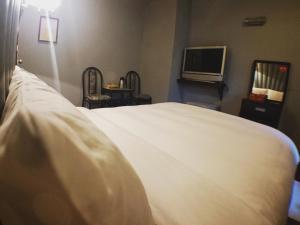 Letto o letti in una camera di Fu Chia Hotel