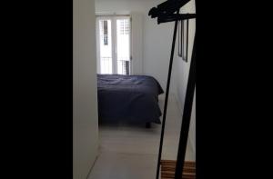 a view of a bedroom with a bed and a camera at Tings Lisbon in Lisbon