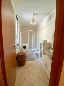 a bathroom with a sink and a toilet at Bilocale grazioso montefiorito in Recco +25 photos