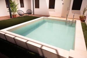 a swimming pool in the backyard of a house at CASIVERDE APARTAMENTO in Córdoba