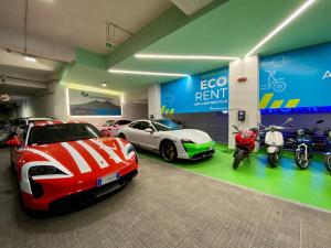 a garage with several cars and motorcycles on display at Maison Toledo 24 in Naples