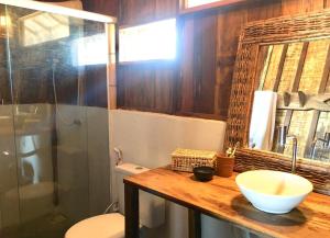 a bathroom with a sink and a toilet and a shower at Divino Tatajuba eco-bungalow, beach kite front, amazing view! in Tatajuba