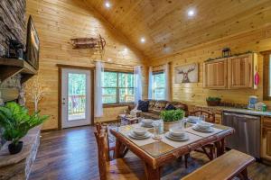 a dining room and living room with a table at The Honeycomb Hideaway in Sevierville