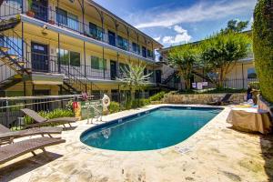 a swimming pool in front of a building at South River Condo in Austin