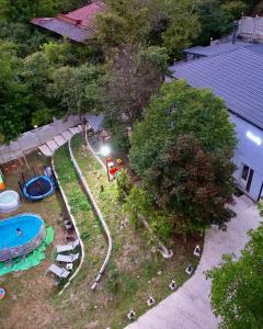 an overhead view of a park with a swimming pool at Serenity Likani Villa Hotel in Borjomi