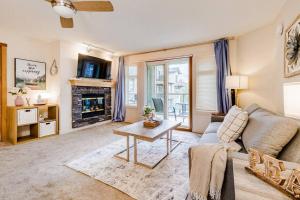 a living room with a couch and a table at Lux 2BR/3BD Suite/Mountain View! in Canmore
