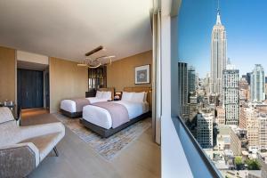 a hotel room with a view of a city at The Ritz-Carlton New York, NoMad in New York