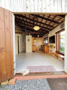 an empty room with a dog laying on the floor at Loft romântico pé na areia in Itapoa