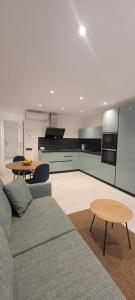 a living room with a couch and a table at Sabbia Suites Varadero in Puerto del Carmen