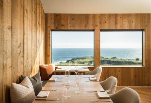 a dining room with a table with wine glasses at The Sea Ranch Lodge in Sea Ranch