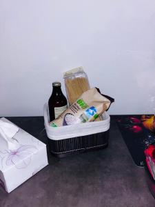 a container of food and a bottle on a table at Historic Alex Castle Apartment Lake Como in Gravedona +46 photos