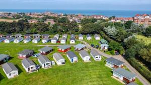 an aerial view of a row of houses on a field at Two Hoots Chalet in Mundesley