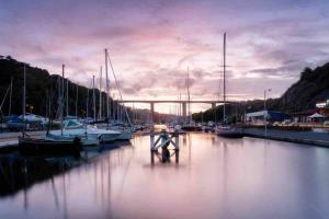 a group of boats are docked in a marina at Maison, type Triplex atypique de charme in Saint-Brieuc