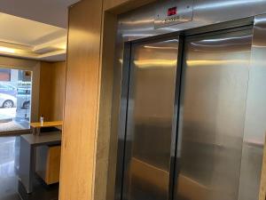a stainless steel refrigerators in a room at Monoambiente en Cañitas in Buenos Aires
