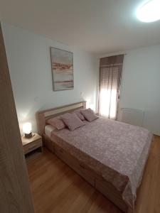 Posteľ alebo postele v izbe v ubytovaní Apartment By Verudela