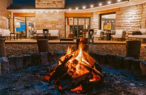 a fire pit in the middle of a patio at La Cascada Casa Patagónica by DON in San Carlos de Bariloche