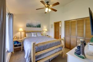 a bedroom with a bed and a ceiling fan at Ski-InandSki-Out Brian Head Condo with Pool Access! in Brian Head