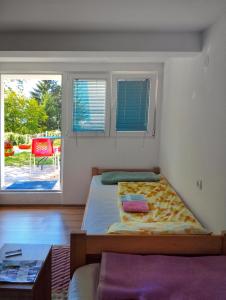 Postel nebo postele na pokoji v ubytování Guesthouse Mirkovic